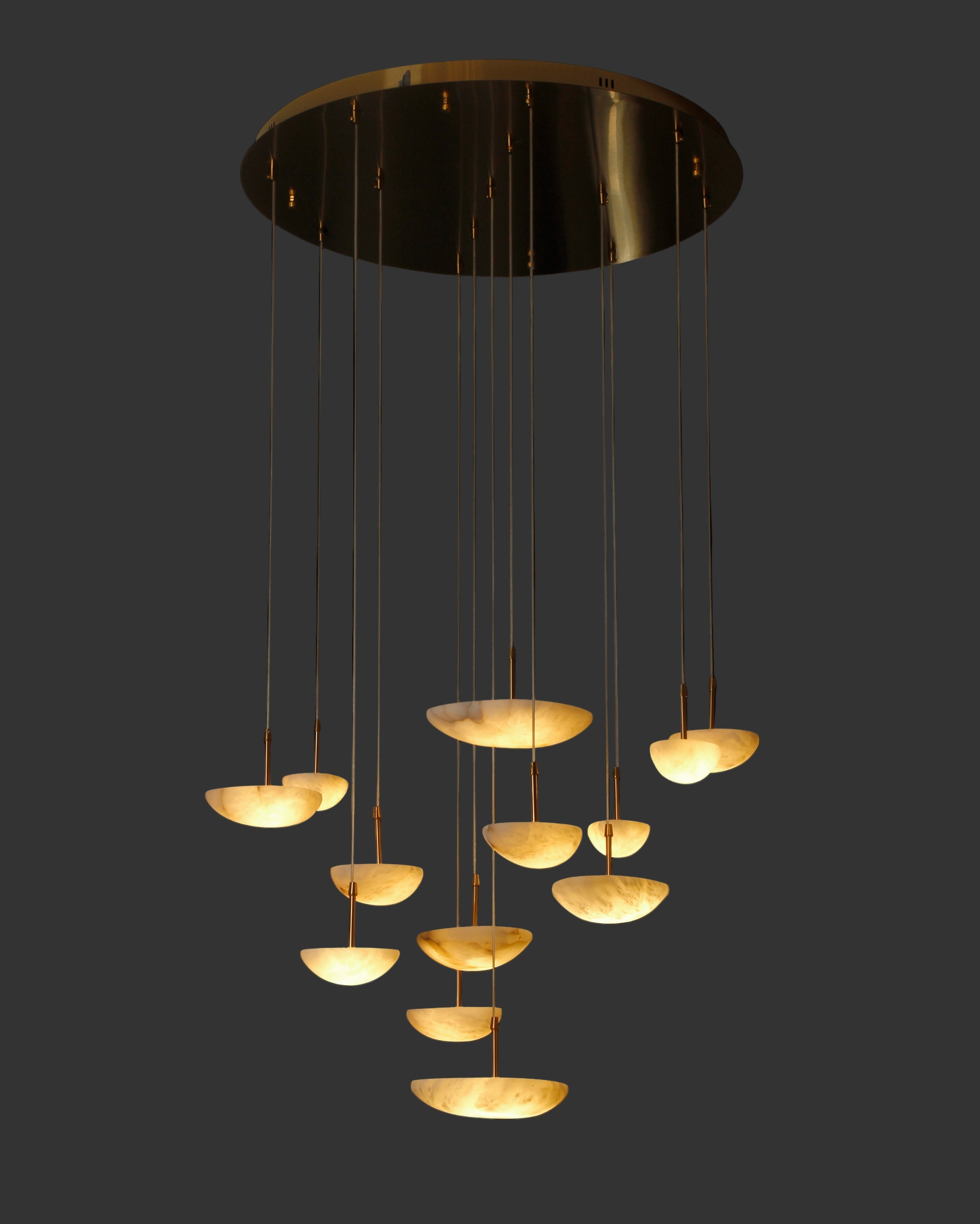 Marble pendant staircase chandelier cascading in modern Dubai interior