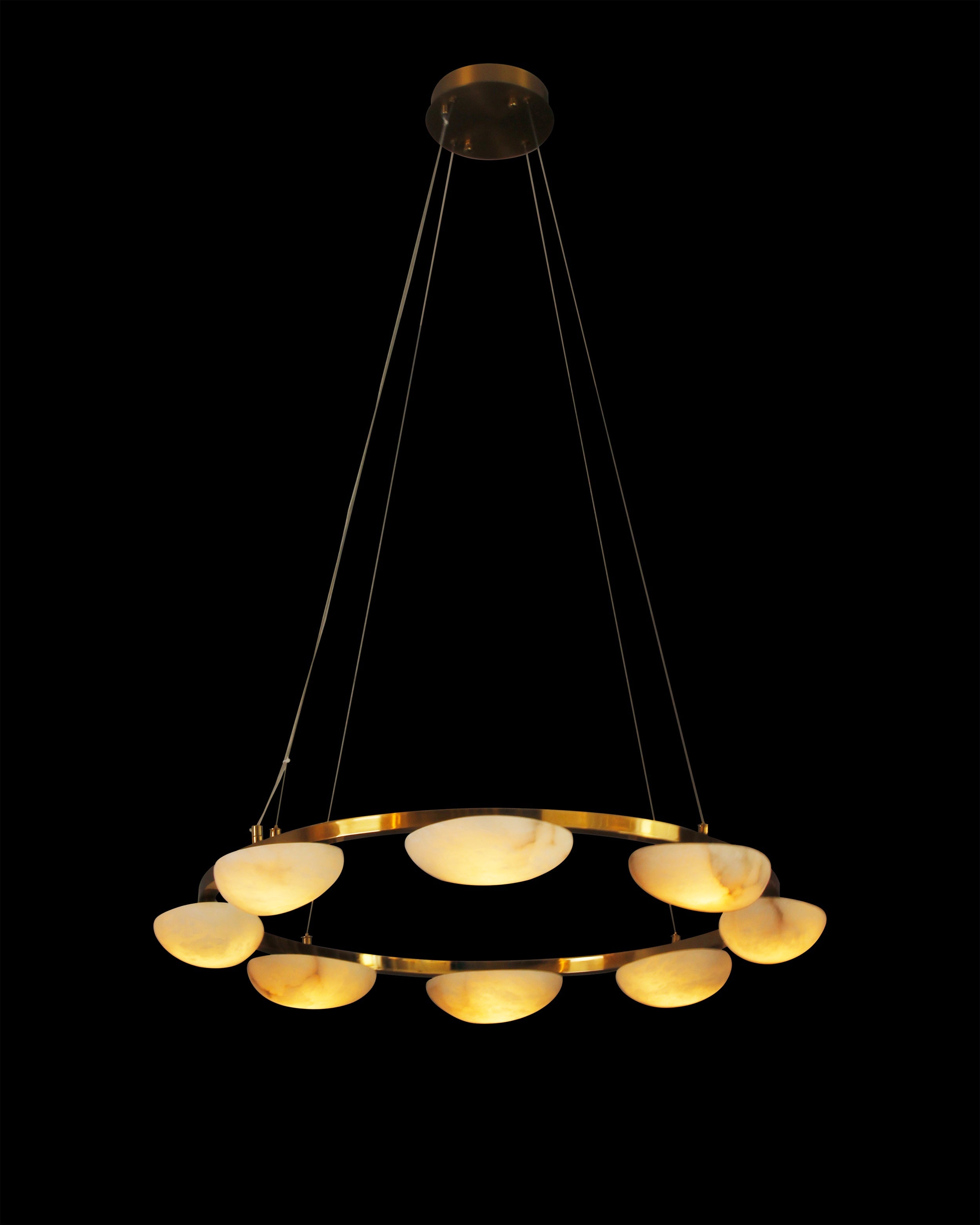 Minimalist circular marble chandelier suspended in UAE villa