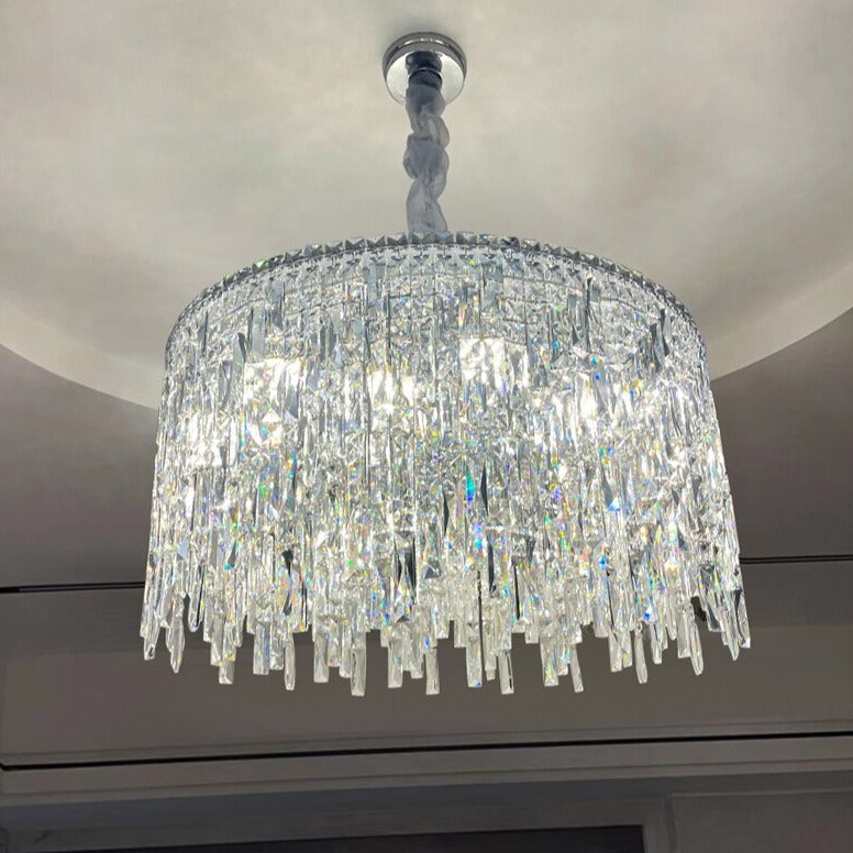 Modern circular crystal chandelier enhancing elegant marble interior in UAE residence