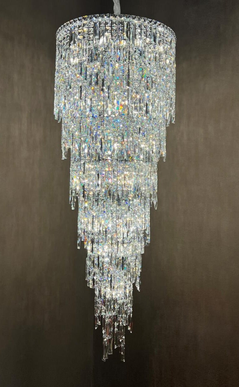 Modern spiral staircase chandelier in contemporary UAE home