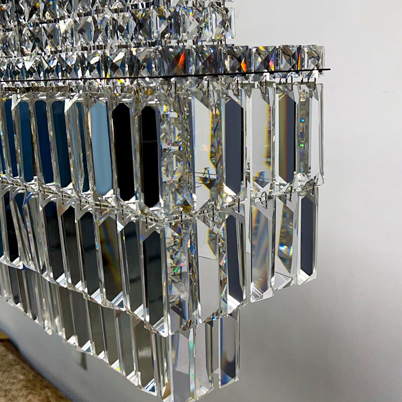 Detailed corner view of rectangular crystal chandelier frame and prisms