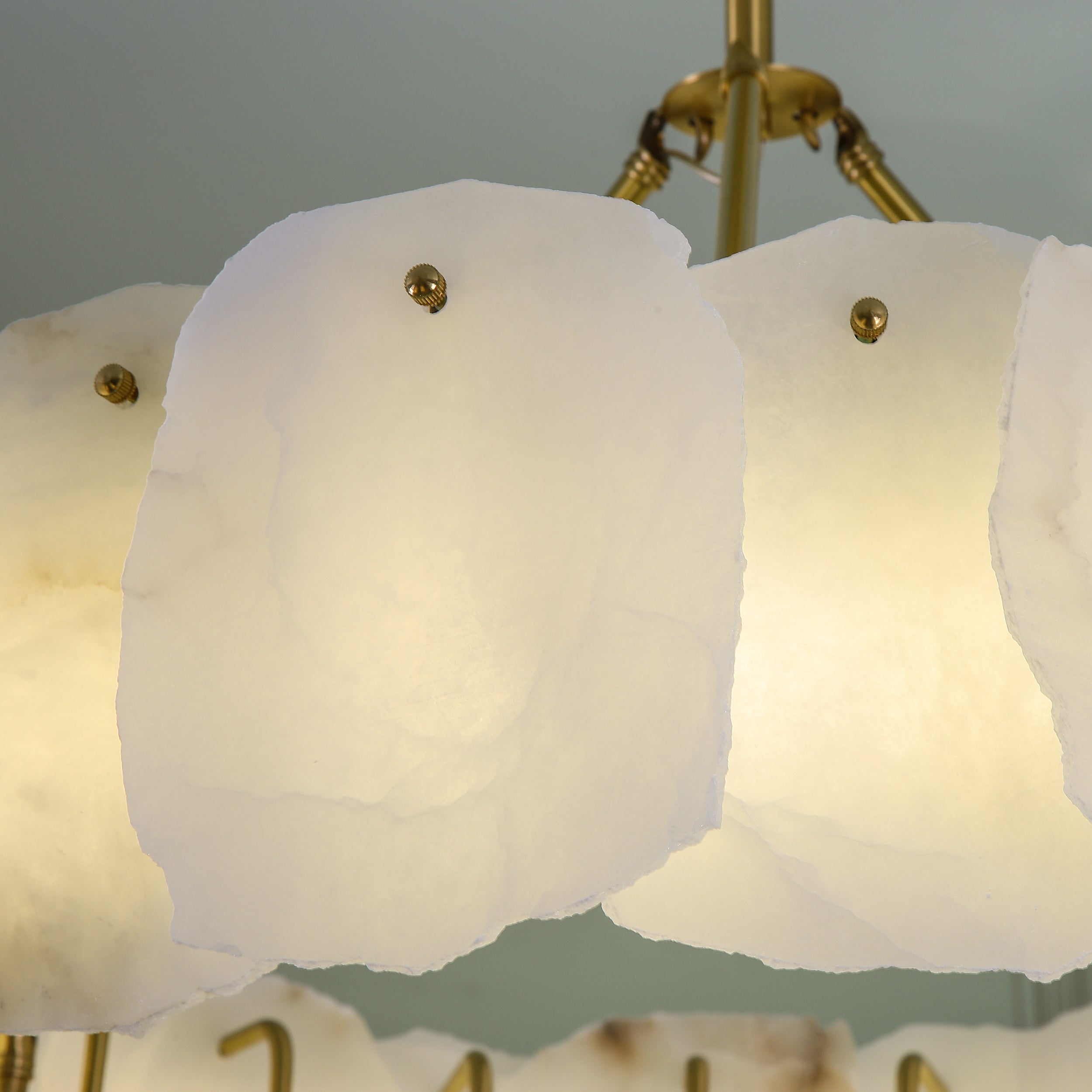 Close up of hand carved natural marble panels on Silvio Marble Circular Chandelier II