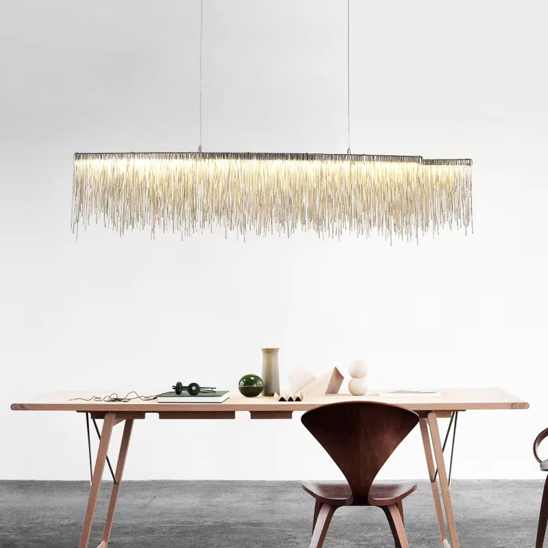 Rectangular modern chandelier centered above dining table UAE