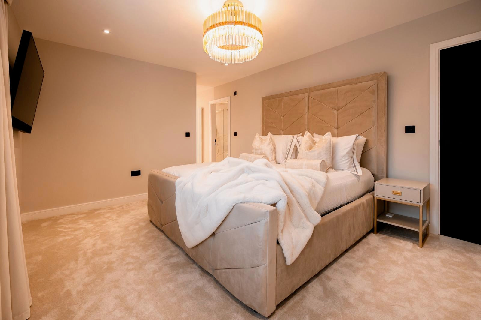 VORELLI® Condotti circular chandelier in a luxury bedroom with warm crystal illumination