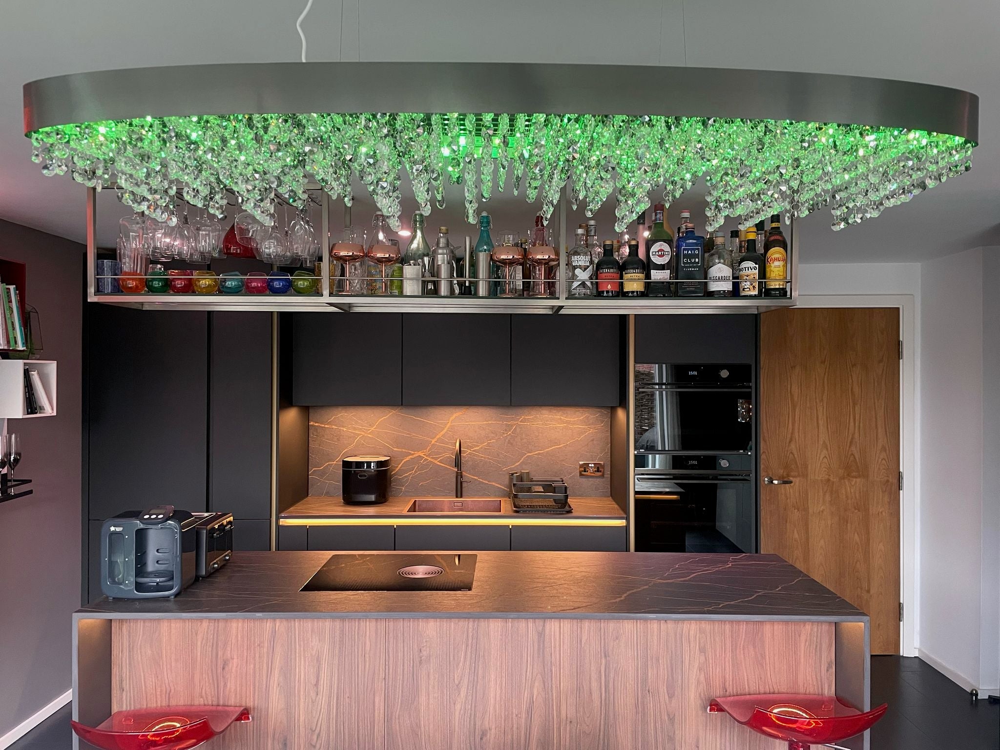 Modern VORELLI® Donatello rectangular chandelier installed above a designer kitchen ceiling feature