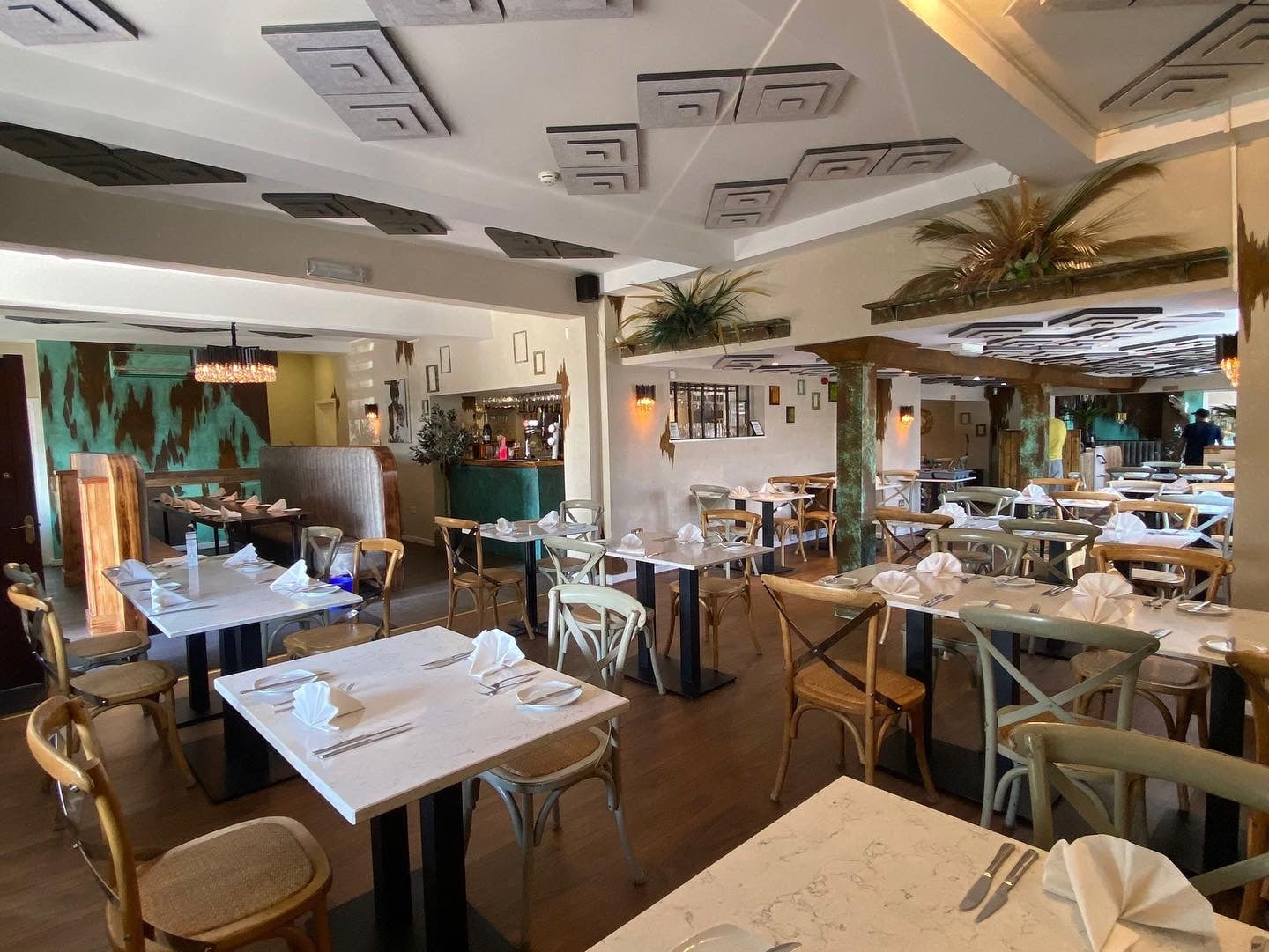 Doral designer wall light by VORELLI enhancing upscale bar and dining interior lighting