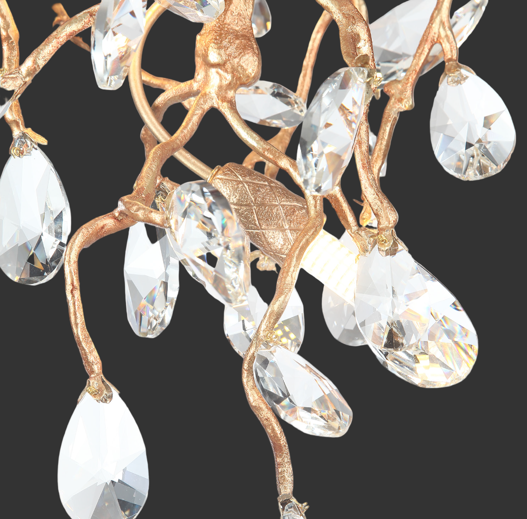 Detail of crystal drops and sculptural branches on the Entwine chandelier