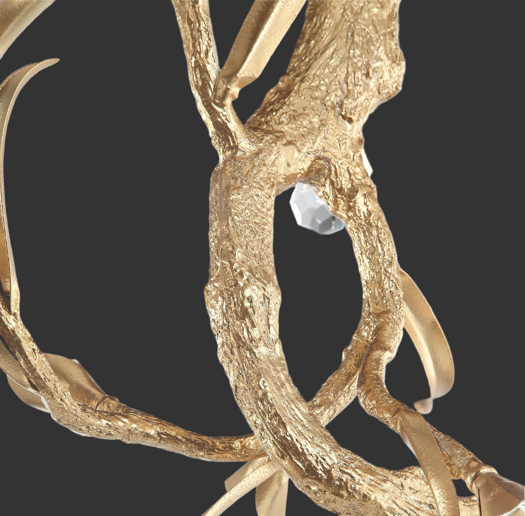 Close-up of Entwine Pendant Light showcasing textured gold branch design and diamond cut crystal detailing