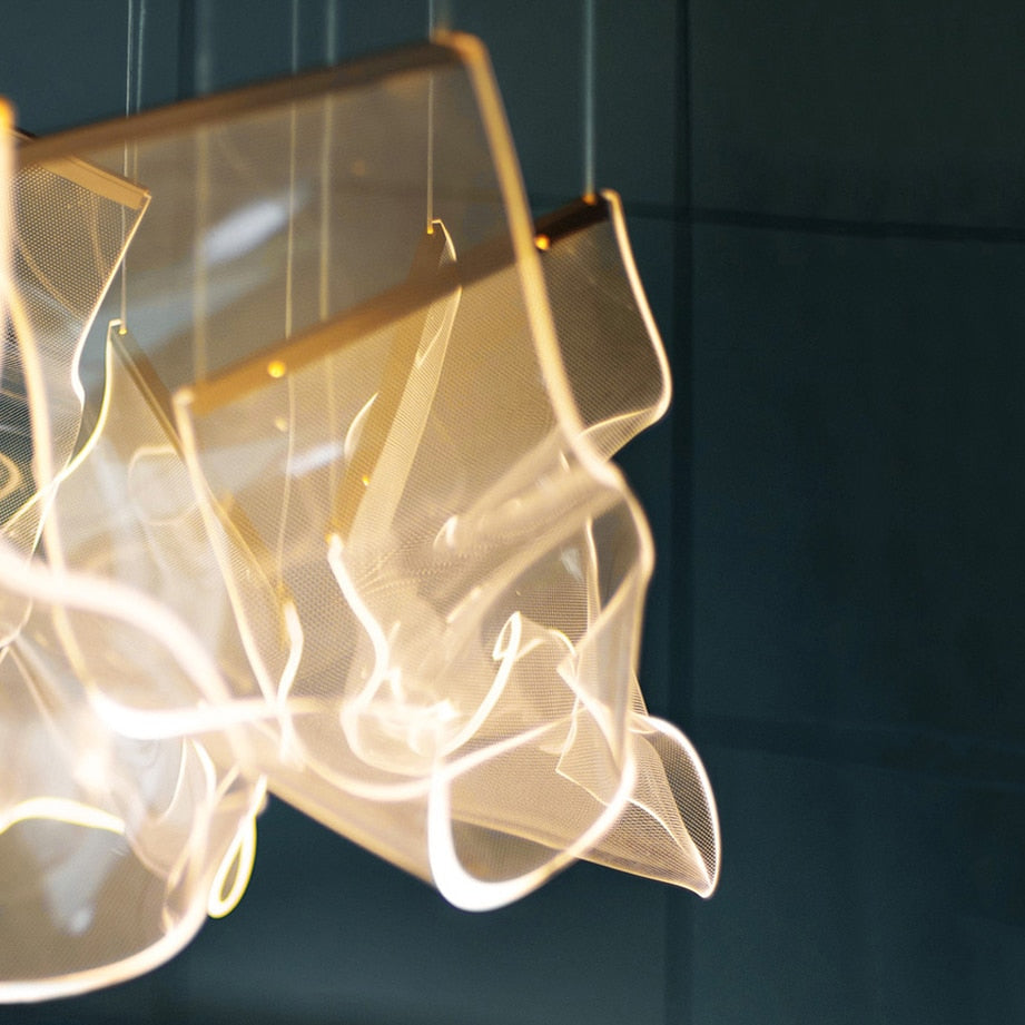 Fluente rectangular chandelier featuring sculptural acrylic LED pendants
