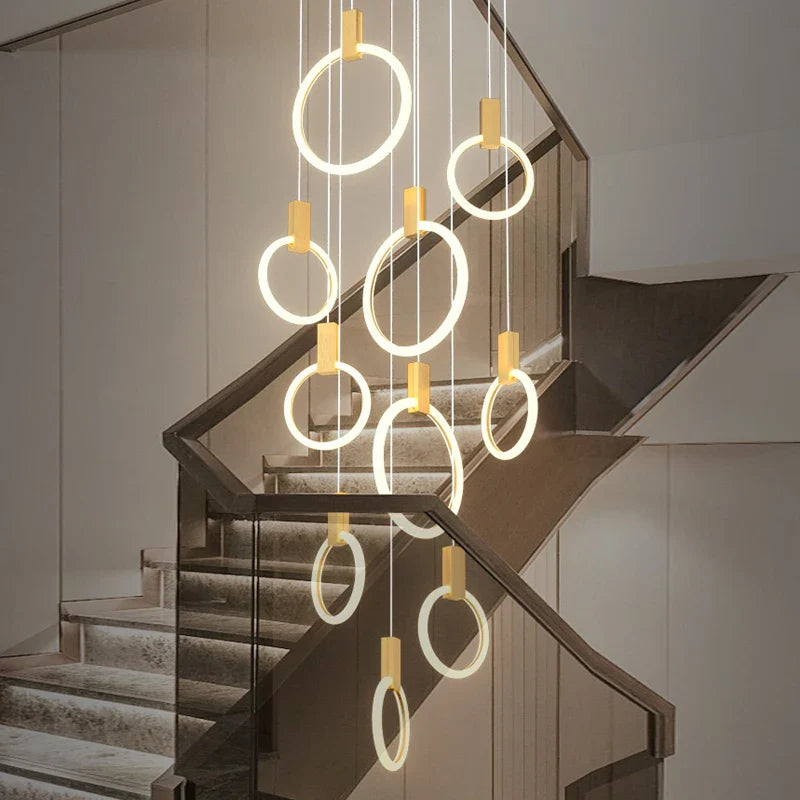 Formby pendant staircase chandelier with cascading LED rings in modern stairwell