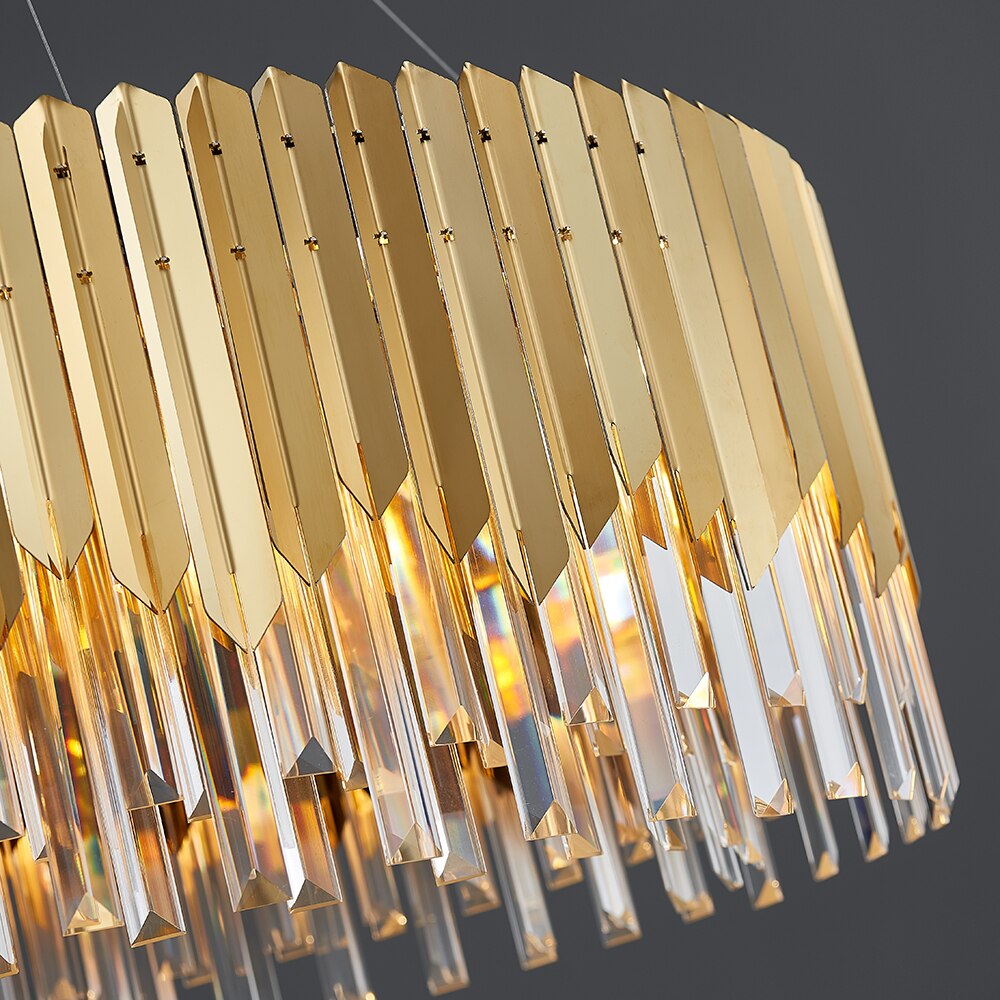 Macro detail of VORELLI Manhattan circular chandelier gold decorative frame and crystal bar edges