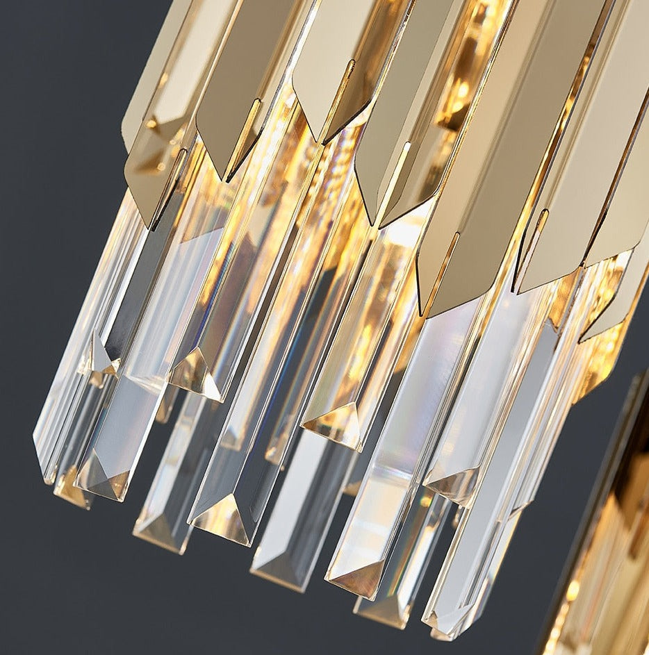 Illuminated crystal bars on the VORELLI Manhattan Rectangular Chandelier II creating warm luxury reflections