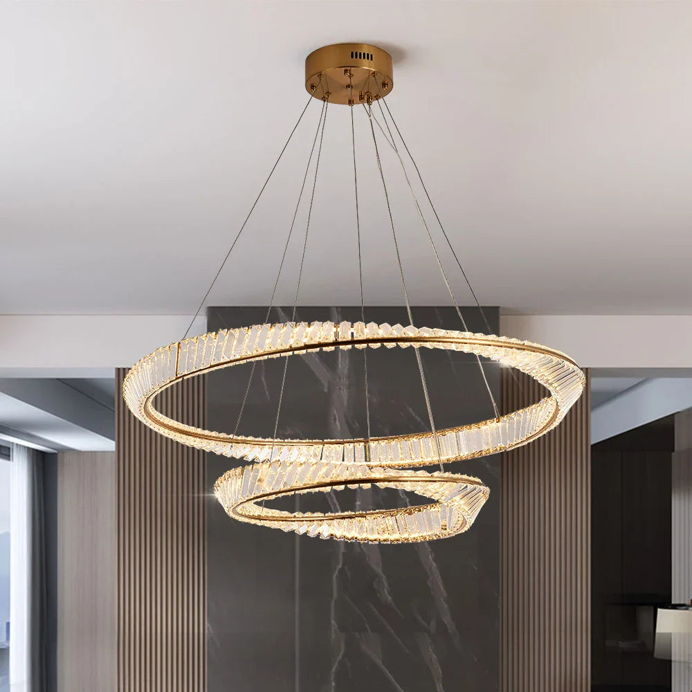 VORELLI Melia double circular chandelier with dual twisted crystal bar rings suspended from a gold ceiling plate