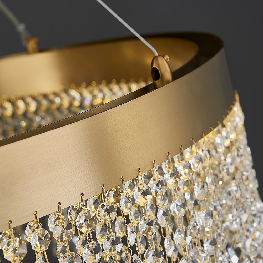 Close up of VORELLI® Modesto oval rectangular chandelier showing sleek elongated frame and cascading crystal chains