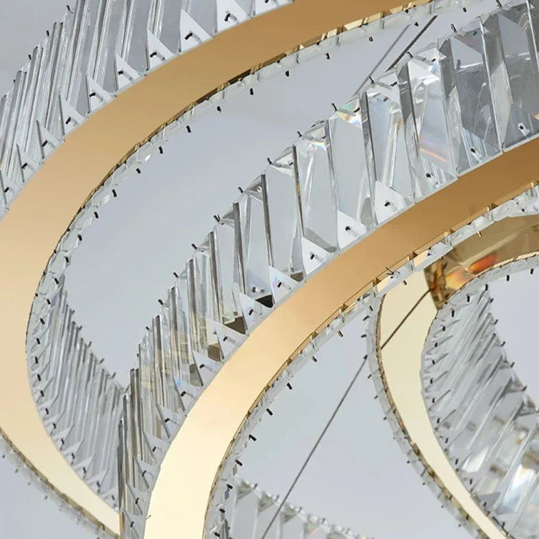 Designer VORELLI® Oia ring chandelier cascading through a luxury stairwell delivering statement architectural lighting
