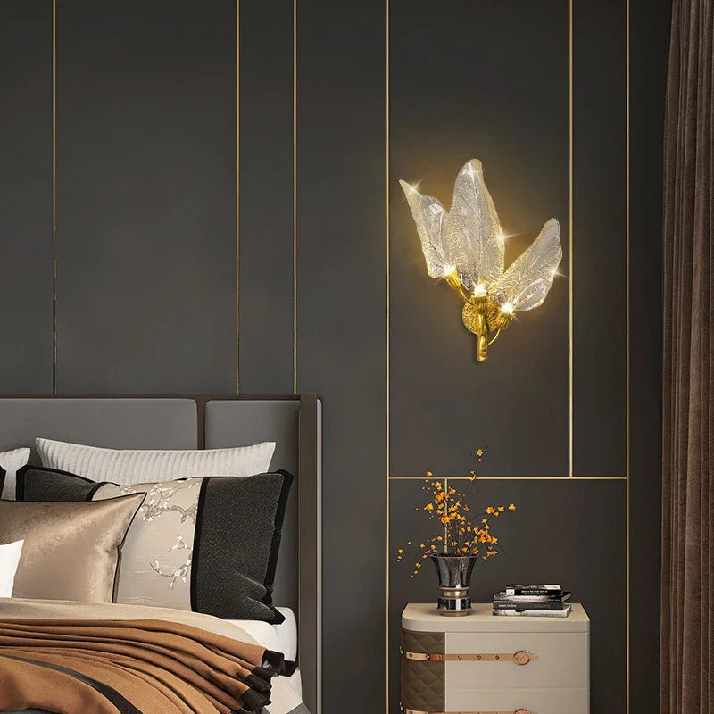 Ottobre wall light with sculpted glass leaves in a luxury bedroom interior