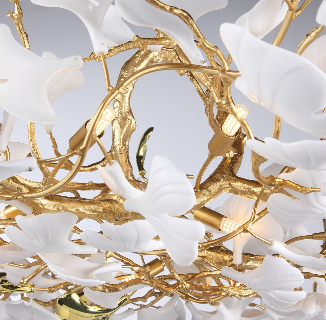 Close-up of Prano Rectangular Chandelier II showing sculpted white glass petals on organic branching frame