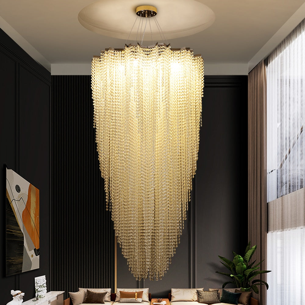 Designer VORELLI® staircase lighting with flowing crystal strands delivering dramatic illumination in premium interior spaces