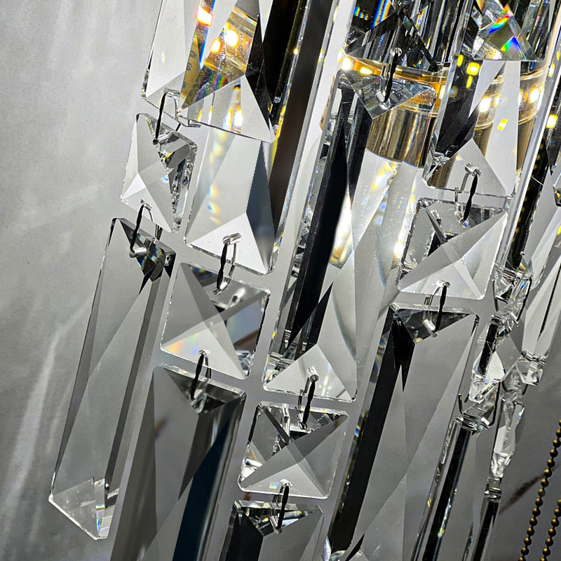 Close up of precision cut crystal prisms on VORELLI wall light