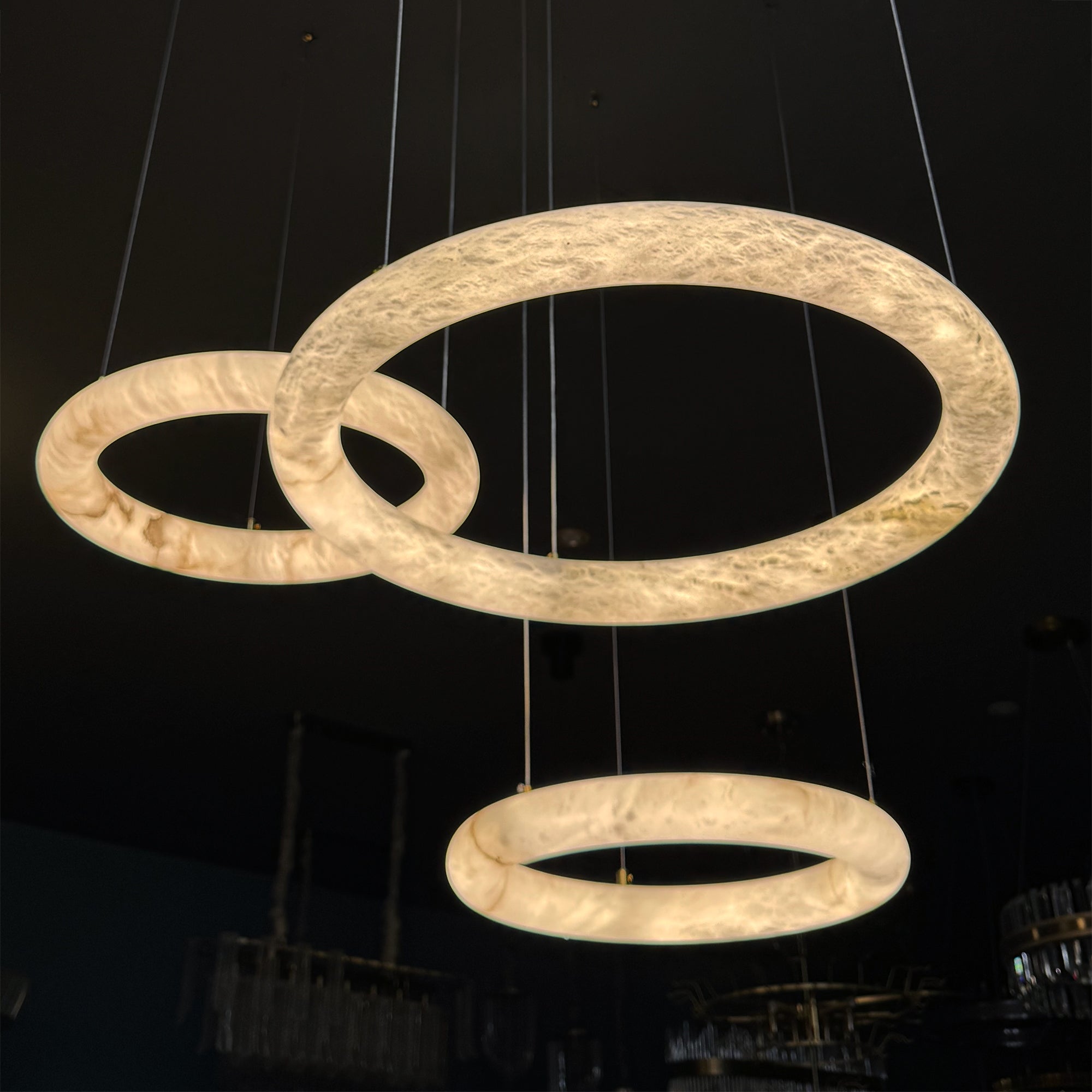 Close-up view of the Cavani Trio Chandelier highlighting the elegant marble ring arrangement