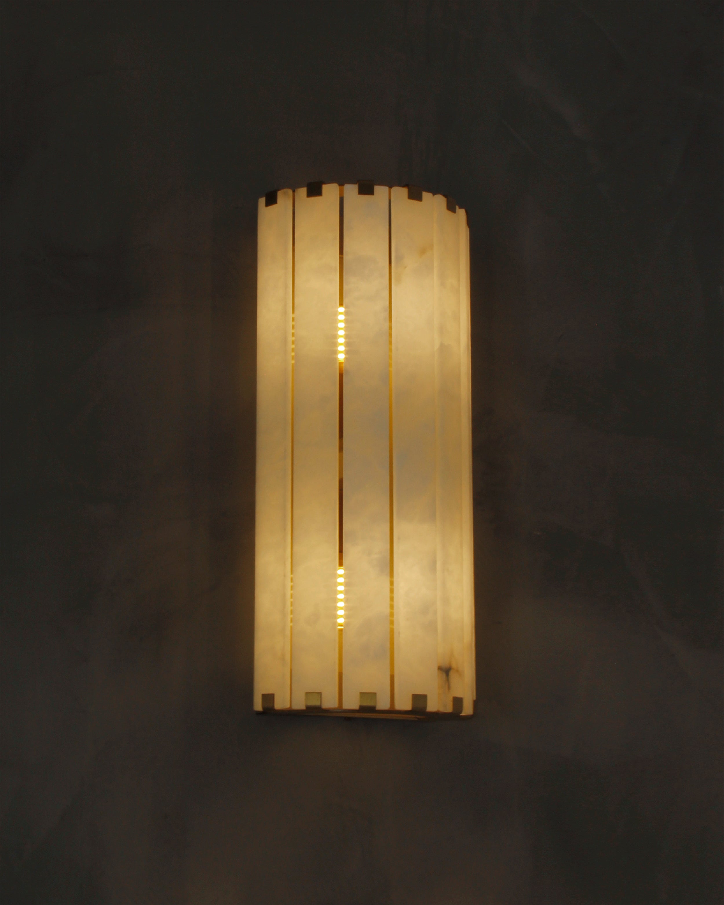 cicci marble wall light illuminated close up showing marble texture