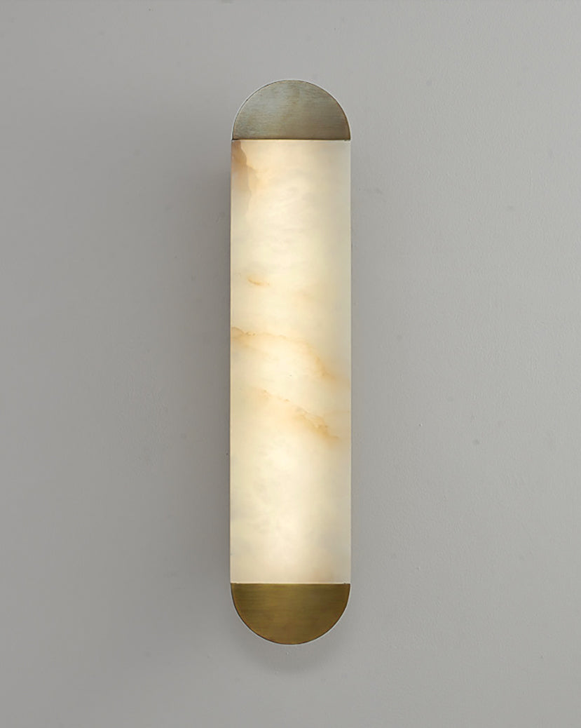 Minimalist marble wall light with rounded silhouette and warm diffused glow
