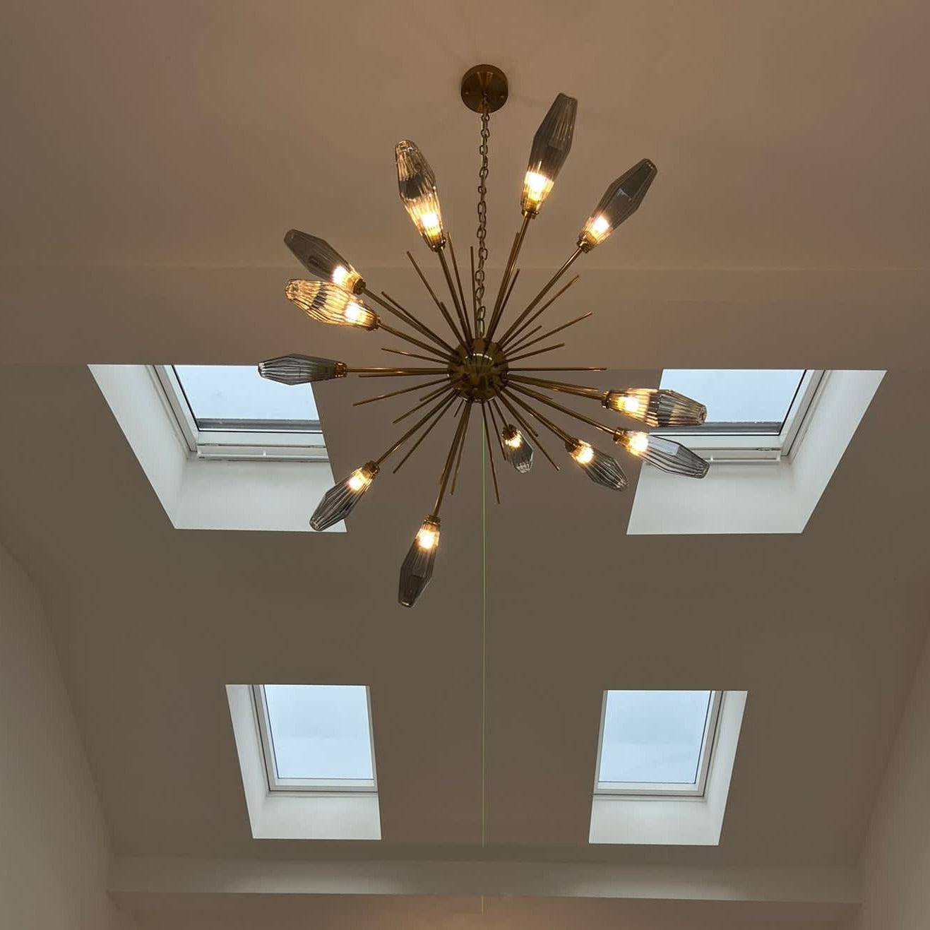 Abdera luxury chandelier installed on double height ceiling in Dubai villa
