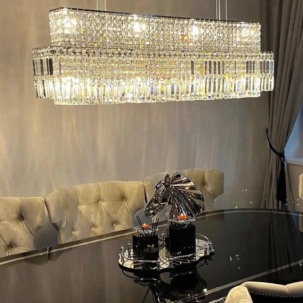 Luxury rectangular crystal chandelier above dining table in Dubai home