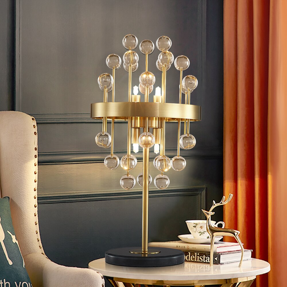 Alytus gold table lamp styled in Dubai living room interior