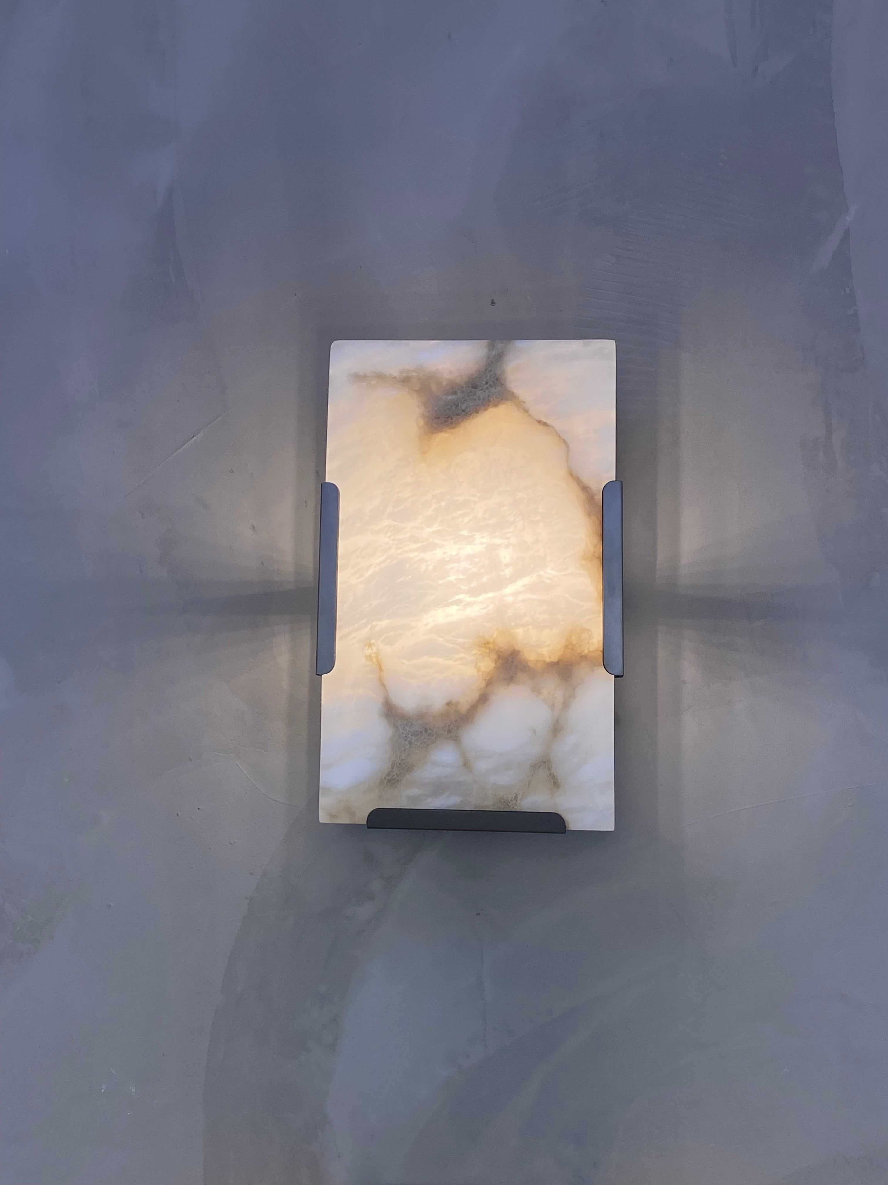 Front view of Angel Marble Wall Light showing veined stone panel