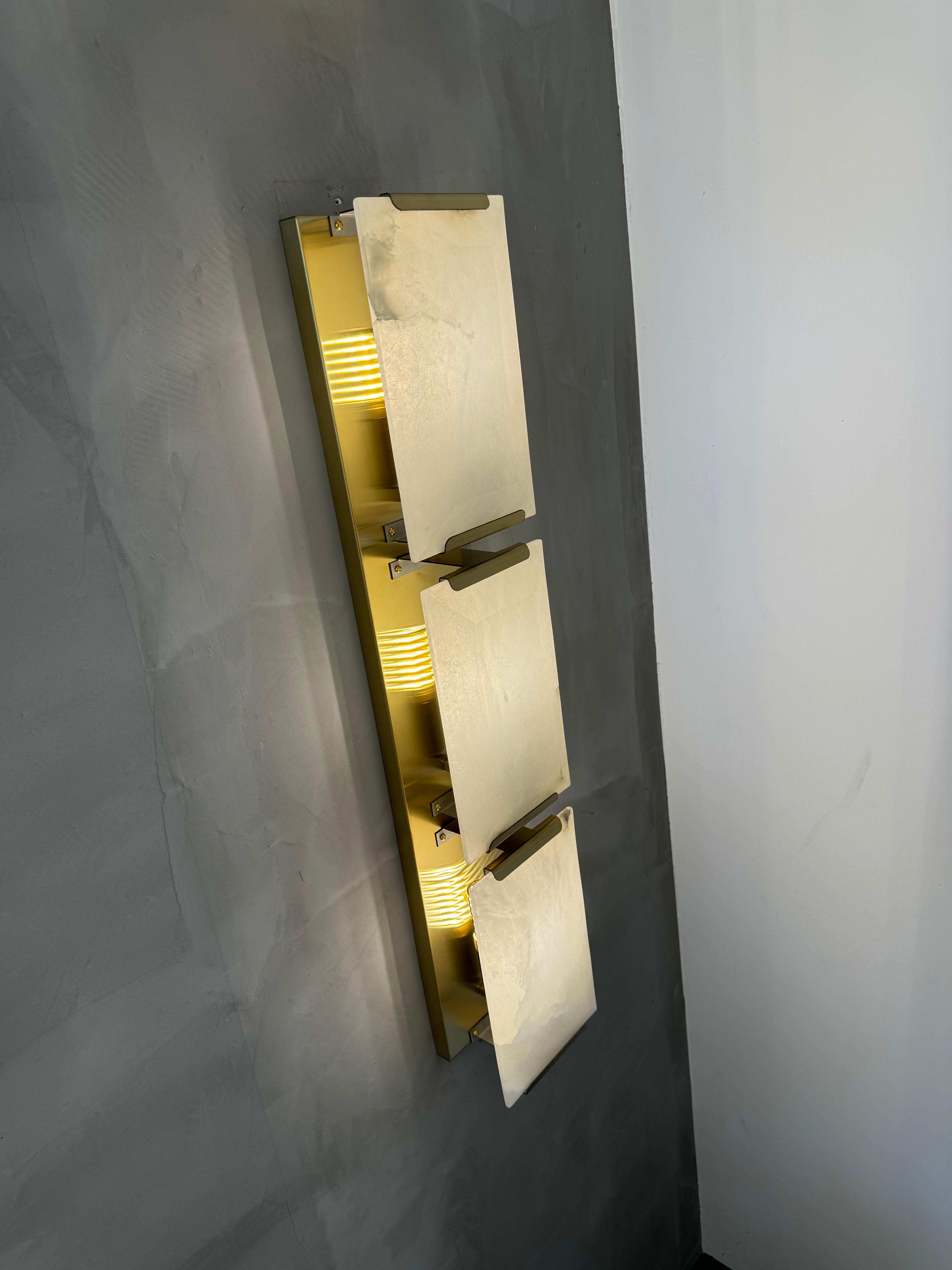 Angled view of Angel Marble Wall Light II showing layered marble design