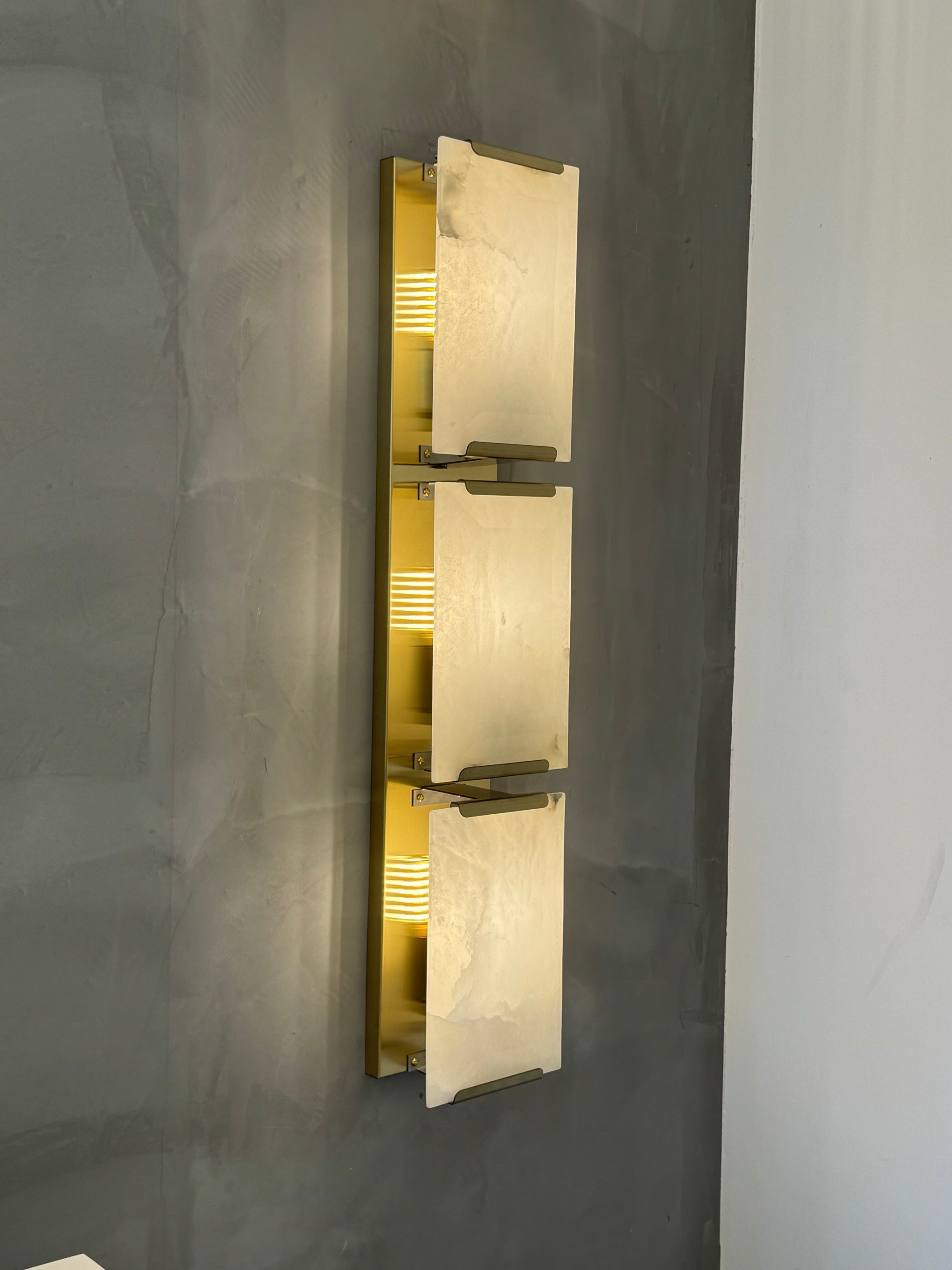 Angel Marble Wall Light II installed vertically on modern interior wall