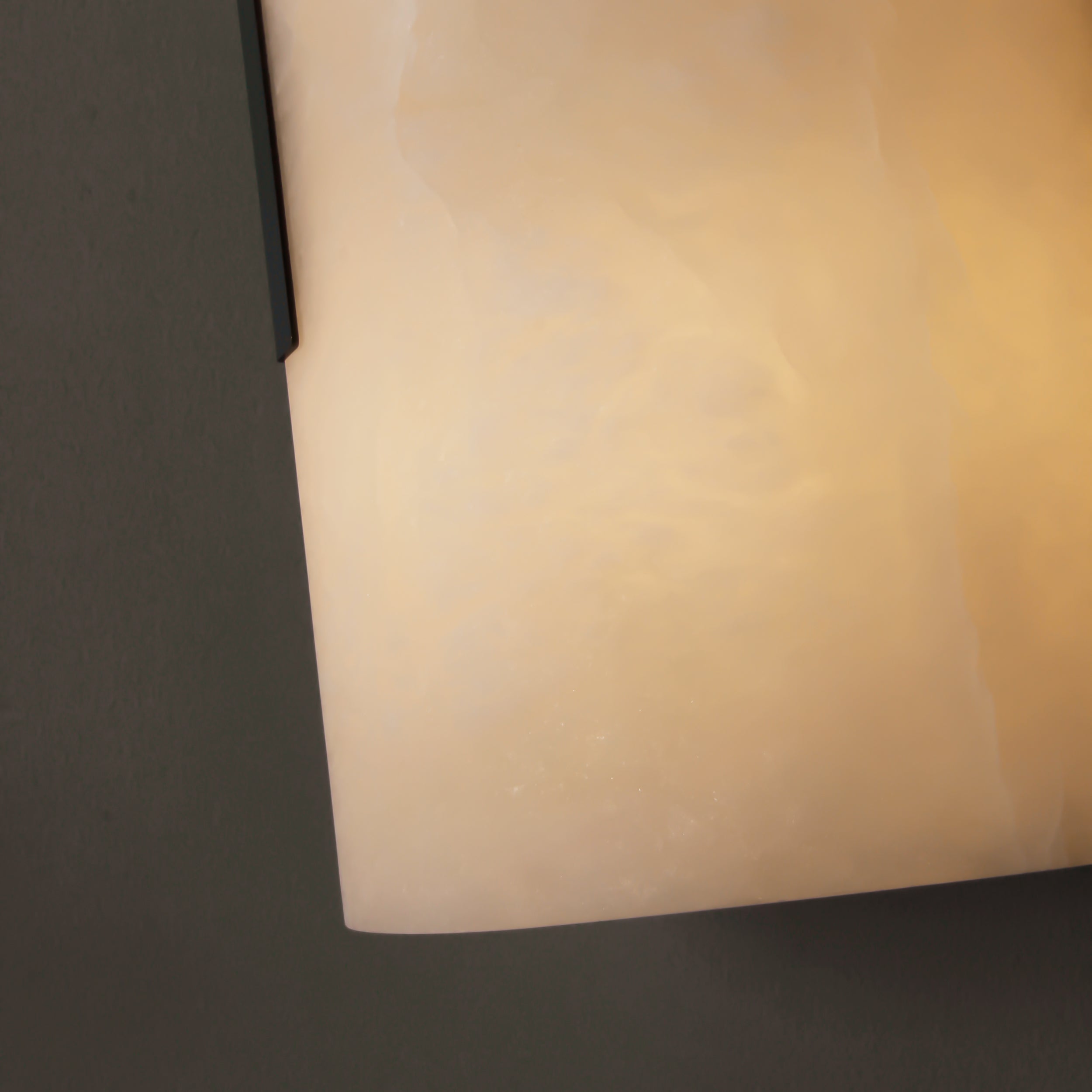 Detail of Arco Marble Wall Light warm ambient illumination