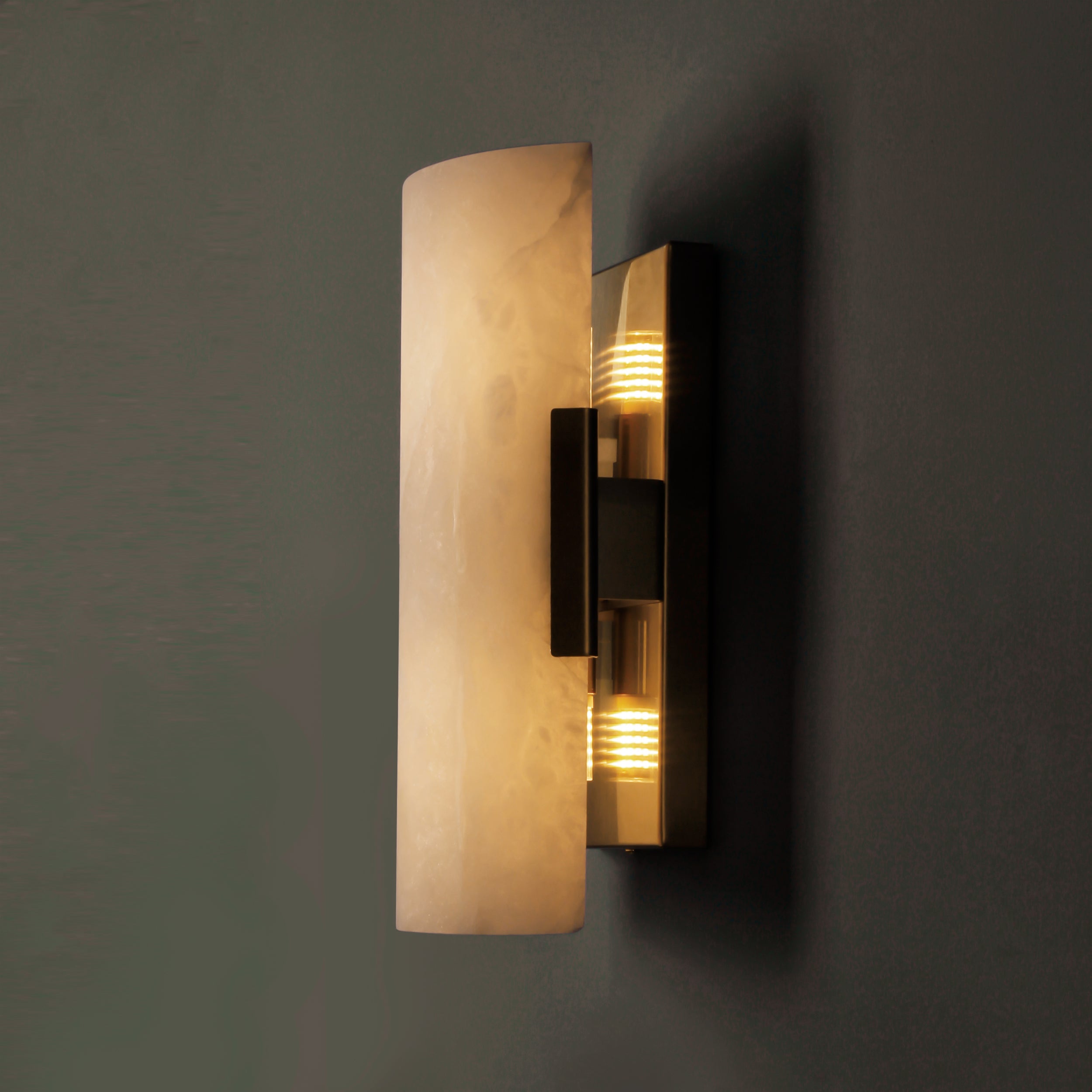 Side profile of Arco Marble Wall Light with black metal accent