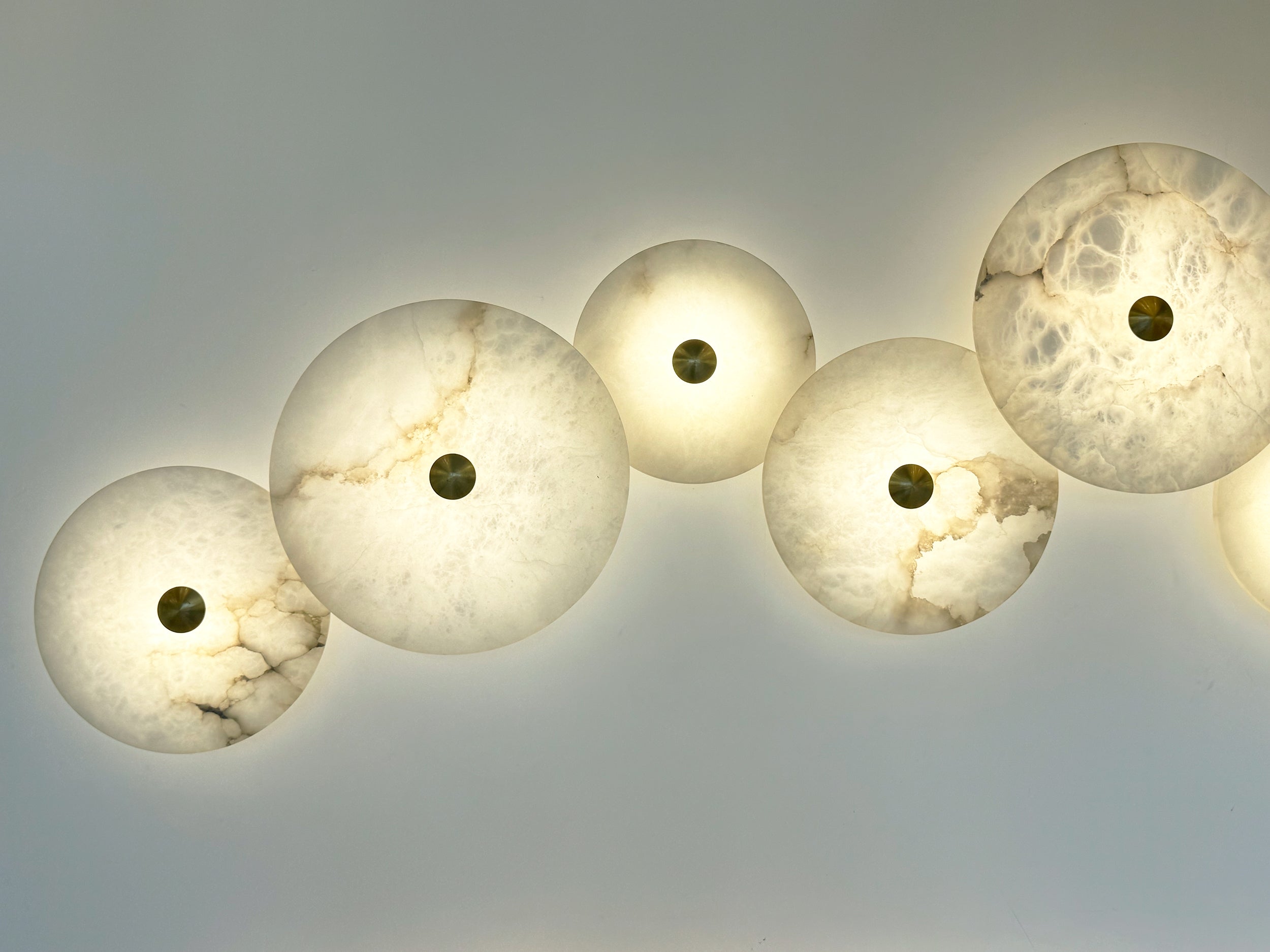 Side view of Aria Marble Wall Light circular marble discs