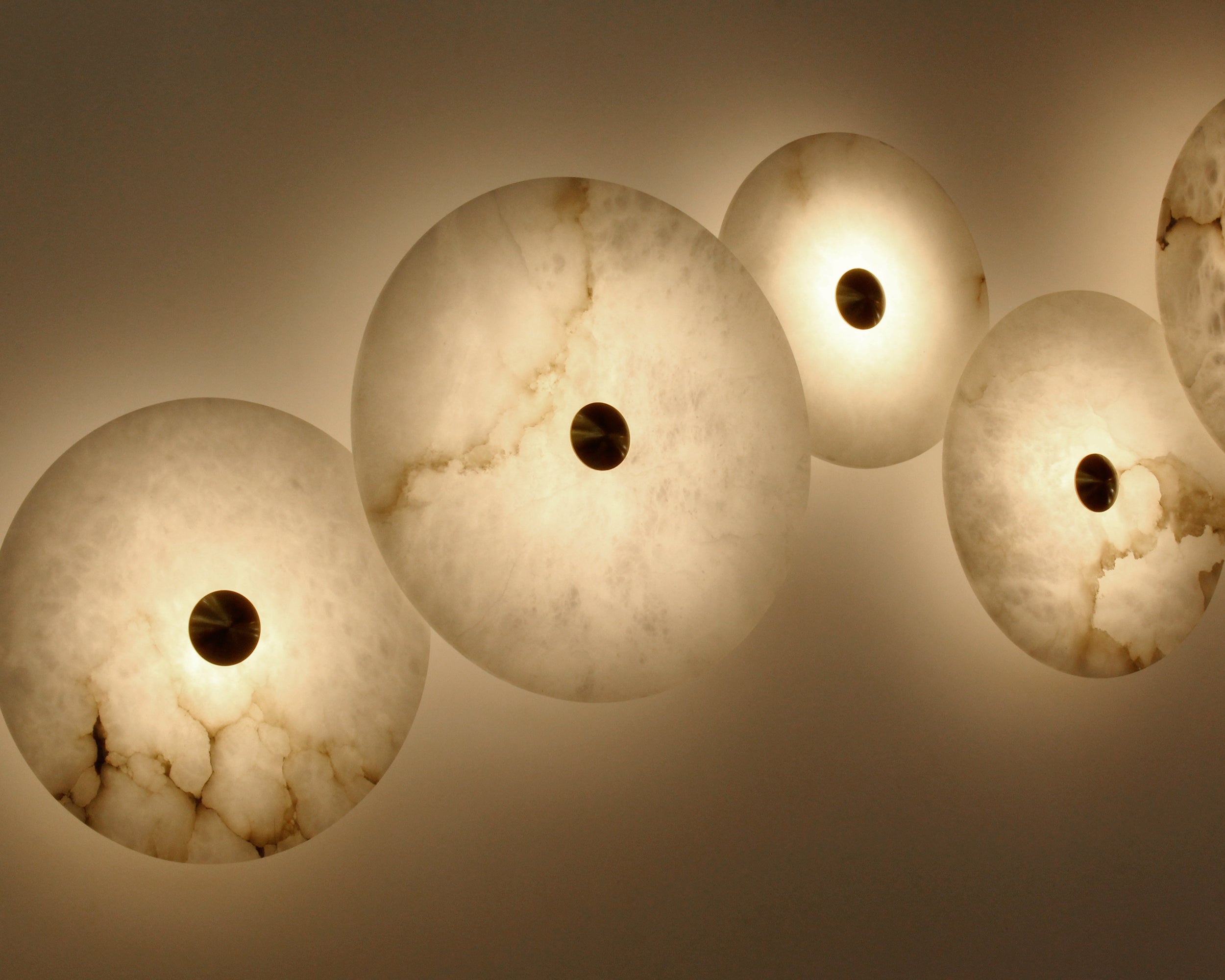 Aria Marble Wall Light creating warm ambient lighting on feature wall
