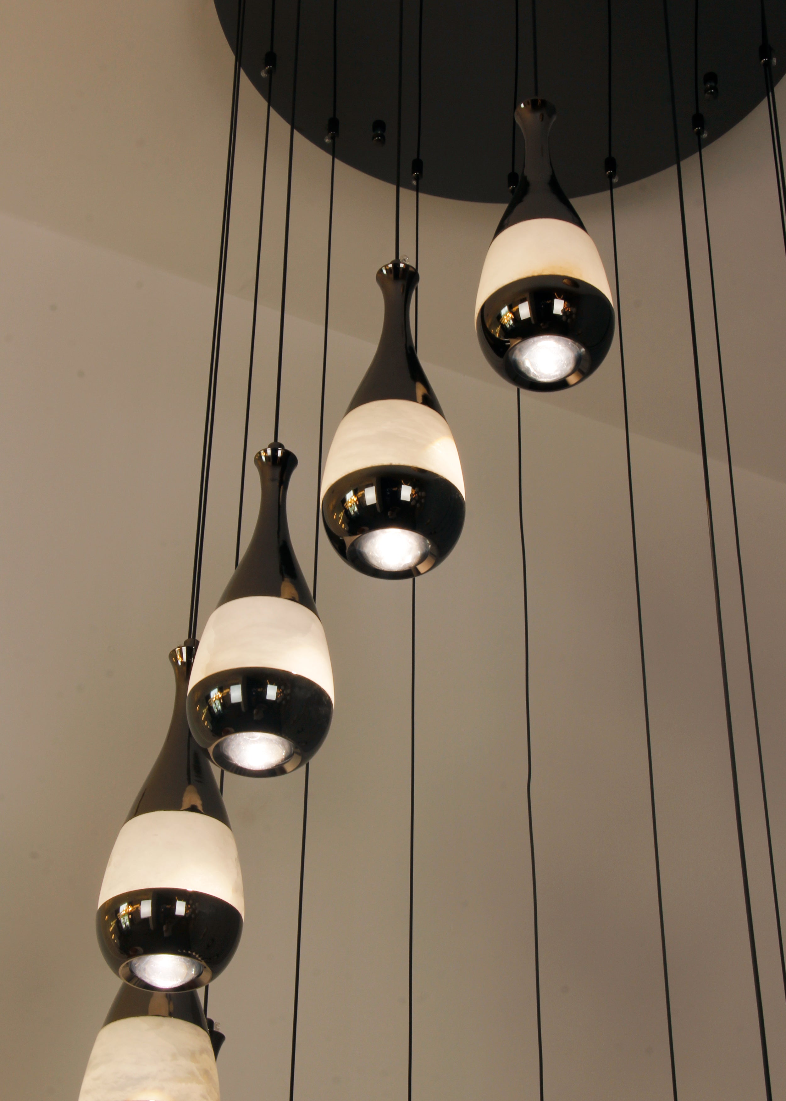 Armonia marble pendants suspended in vertical spiral arrangement