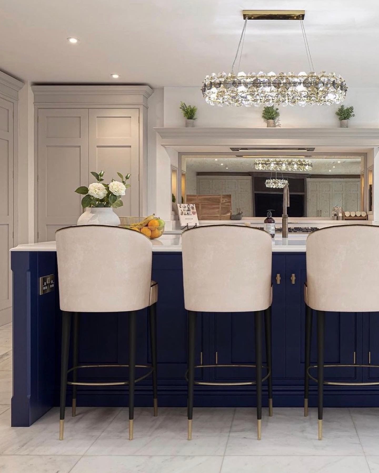 Astoria rectangular chandelier above bar seating area