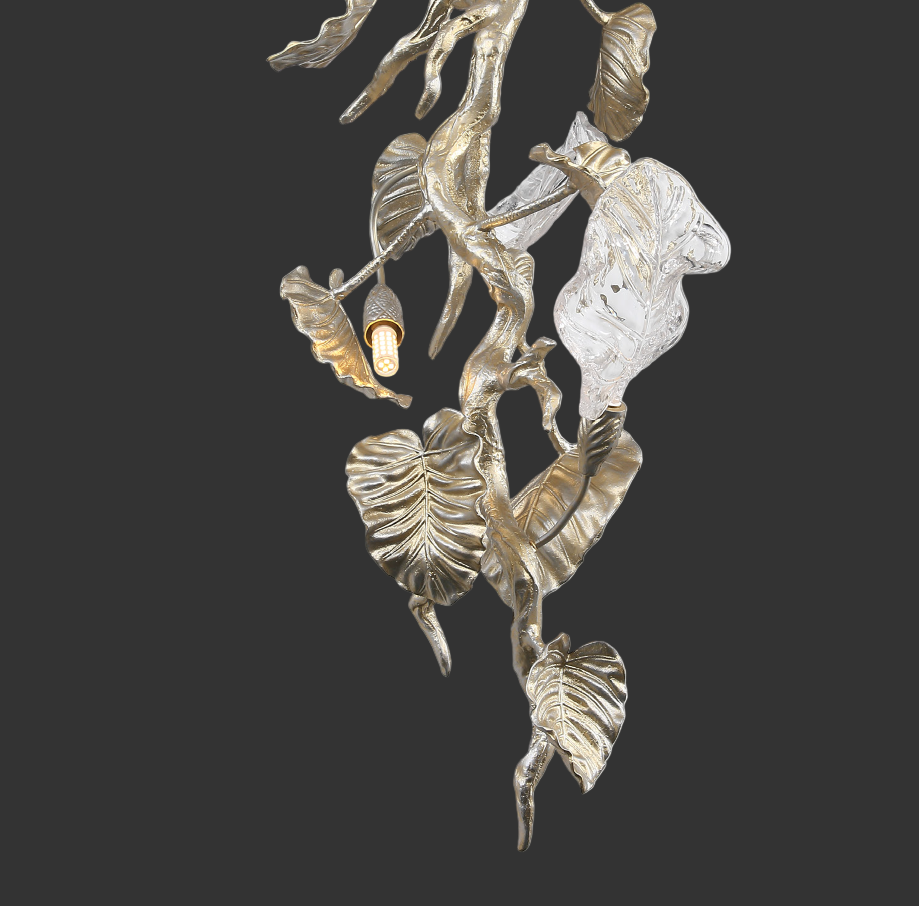 Close up of sculpted glass leaves and metal branches on Aura Leaf chandelier