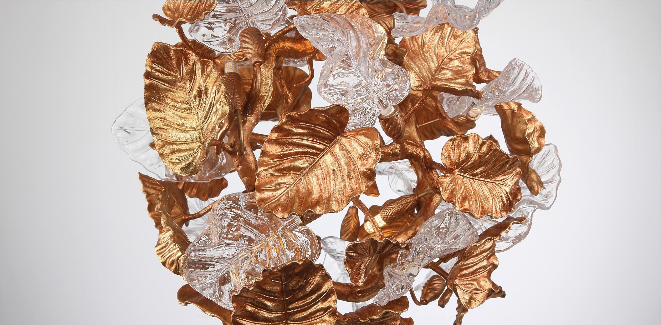 Close-up of metallic leaf and crystal detailing on Autumn Bloom pendant light