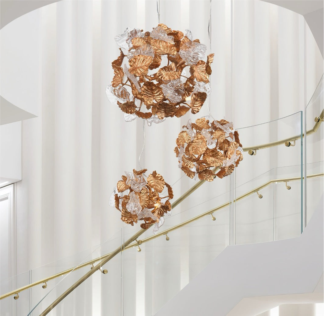 Autumn Bloom sculptural pendant lights installed along luxury staircase
