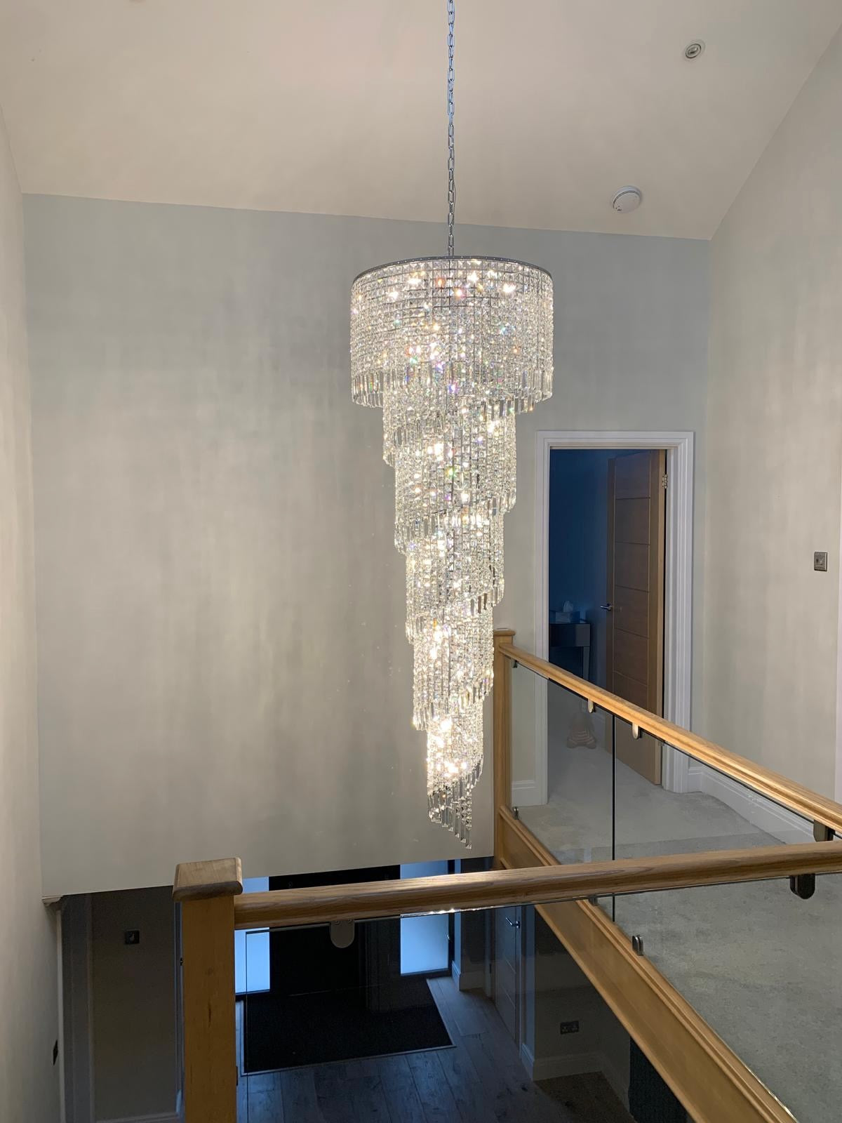 Basiglio crystal spiral chandelier illuminated by natural daylight