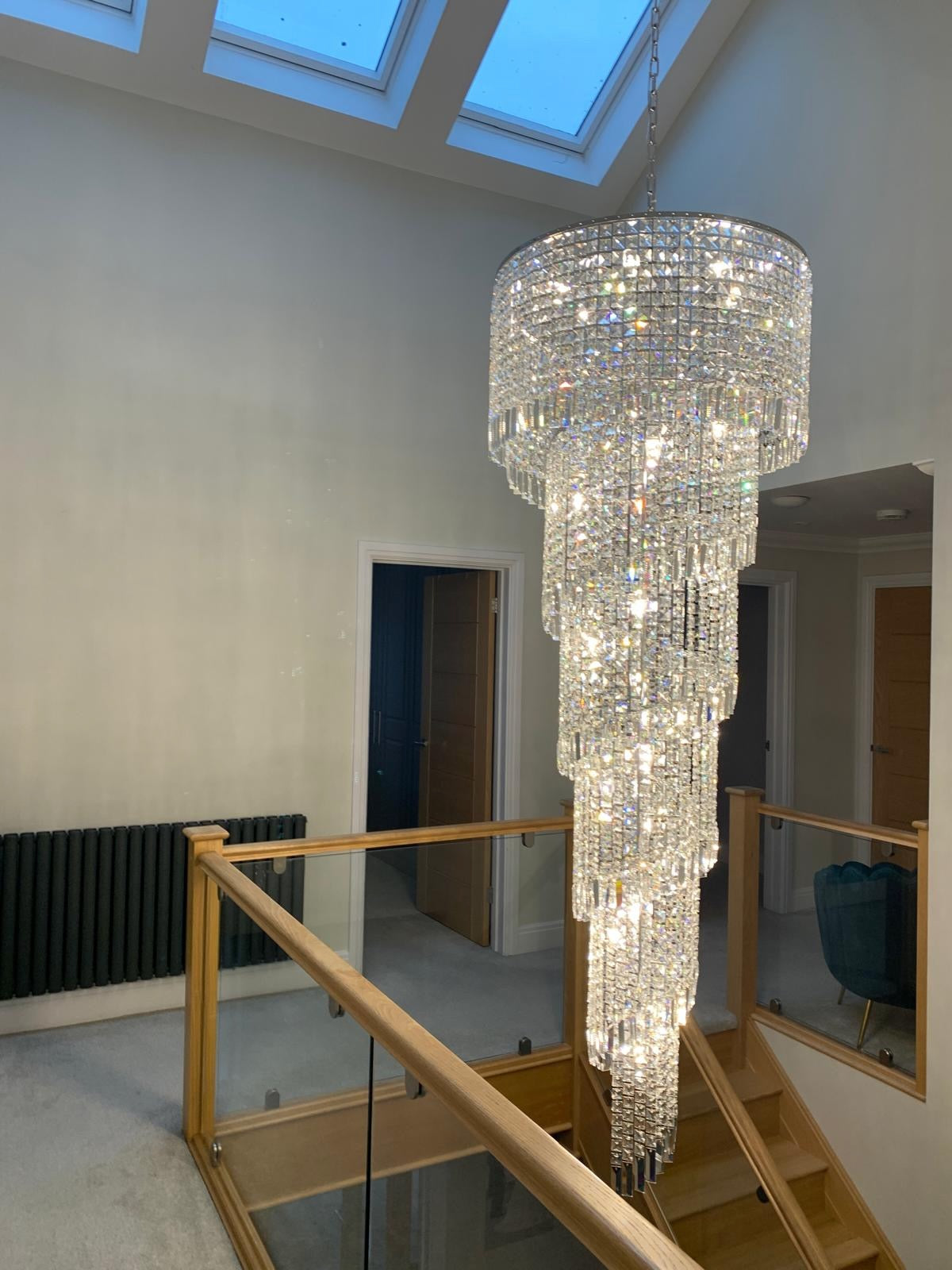 Basiglio spiral staircase chandelier creating dramatic focal point