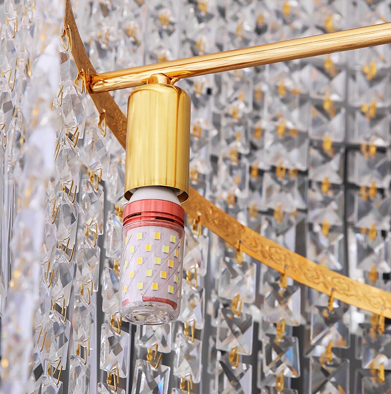 Gold ceiling mount and crystal attachment detail on Basiglio chandelier