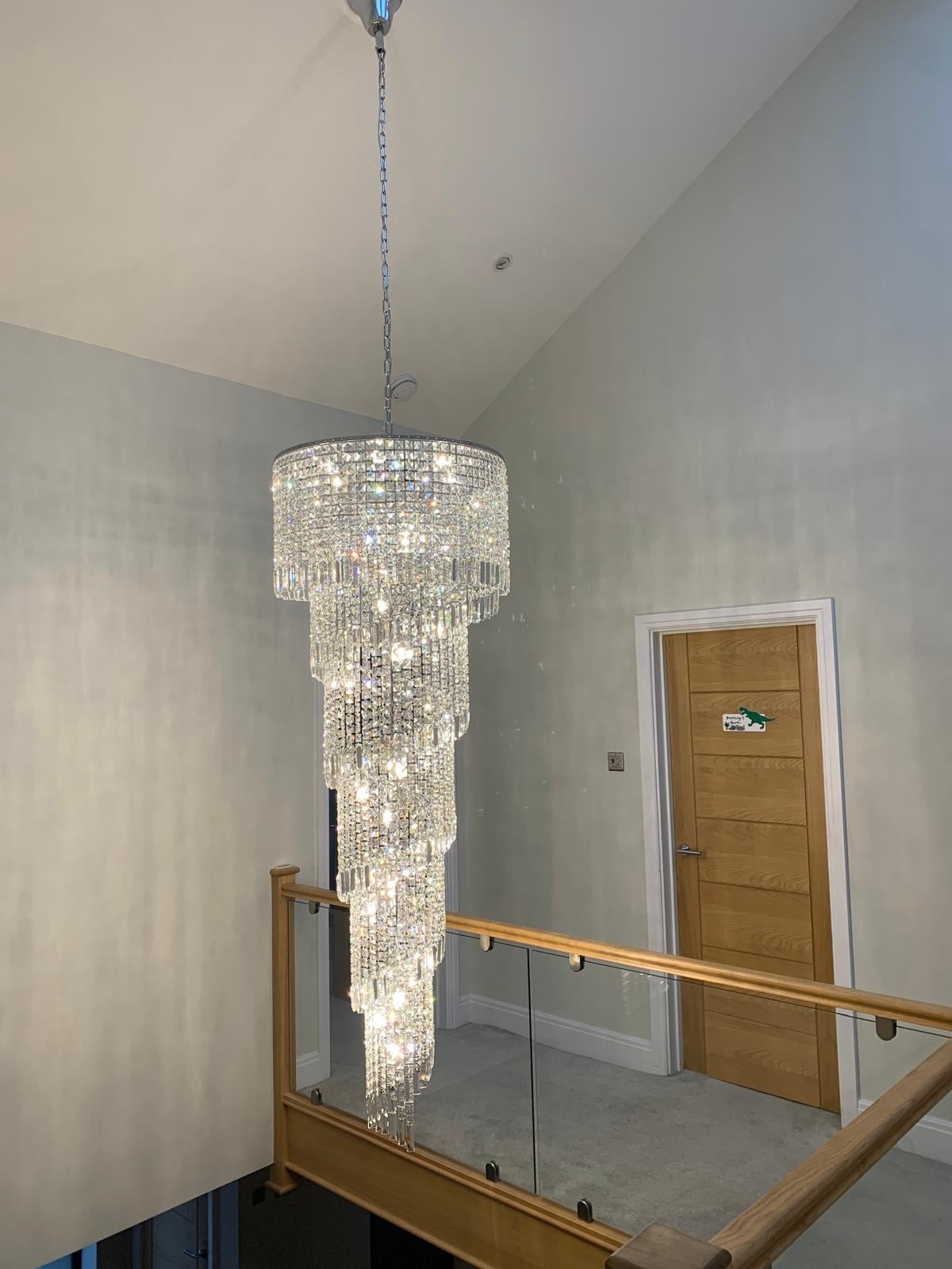 Basiglio spiral crystal chandelier enhancing luxury interior space