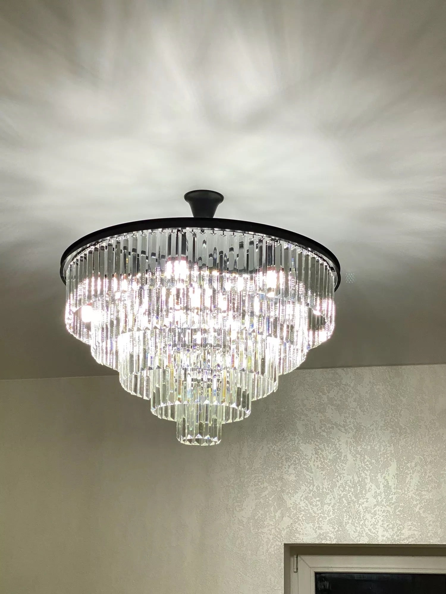 Light reflection pattern from Beckenham circular chandelier
