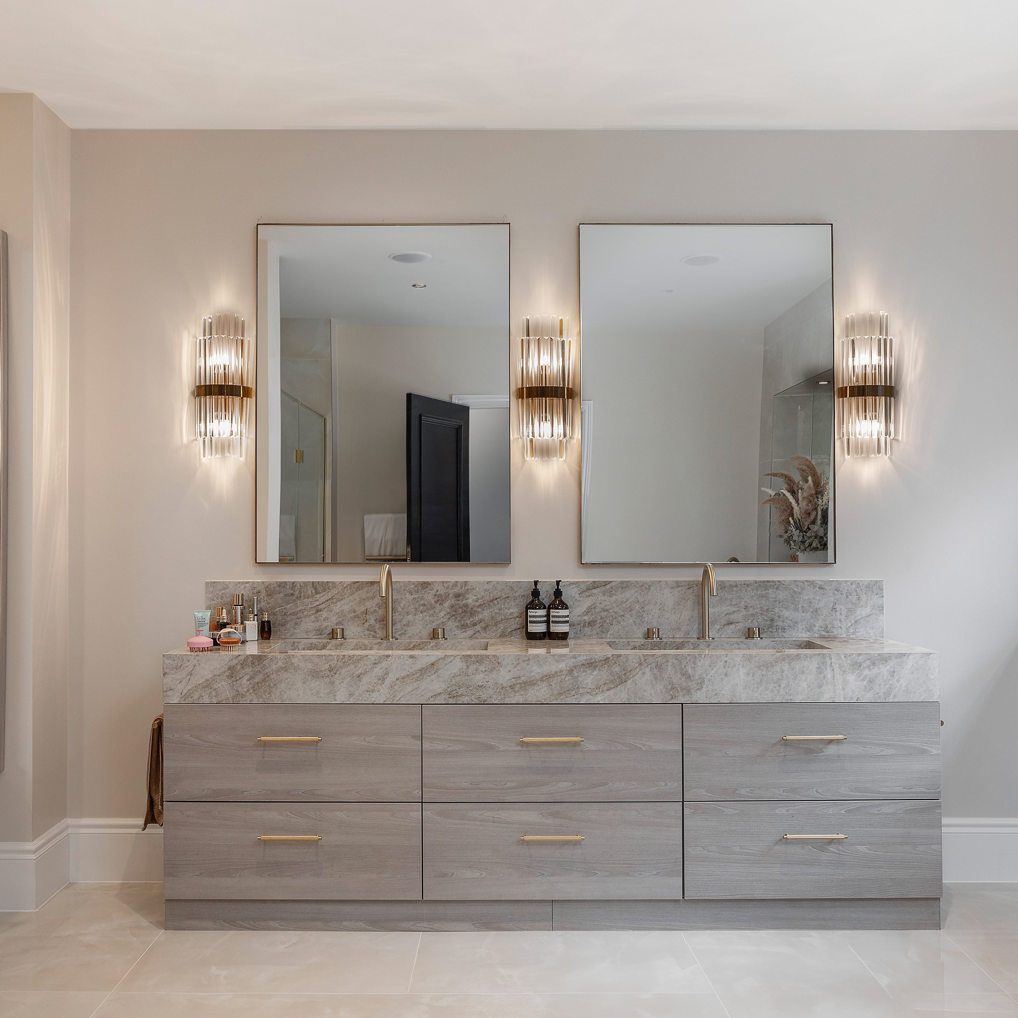 Belair crystal wall light installed beside bathroom mirror