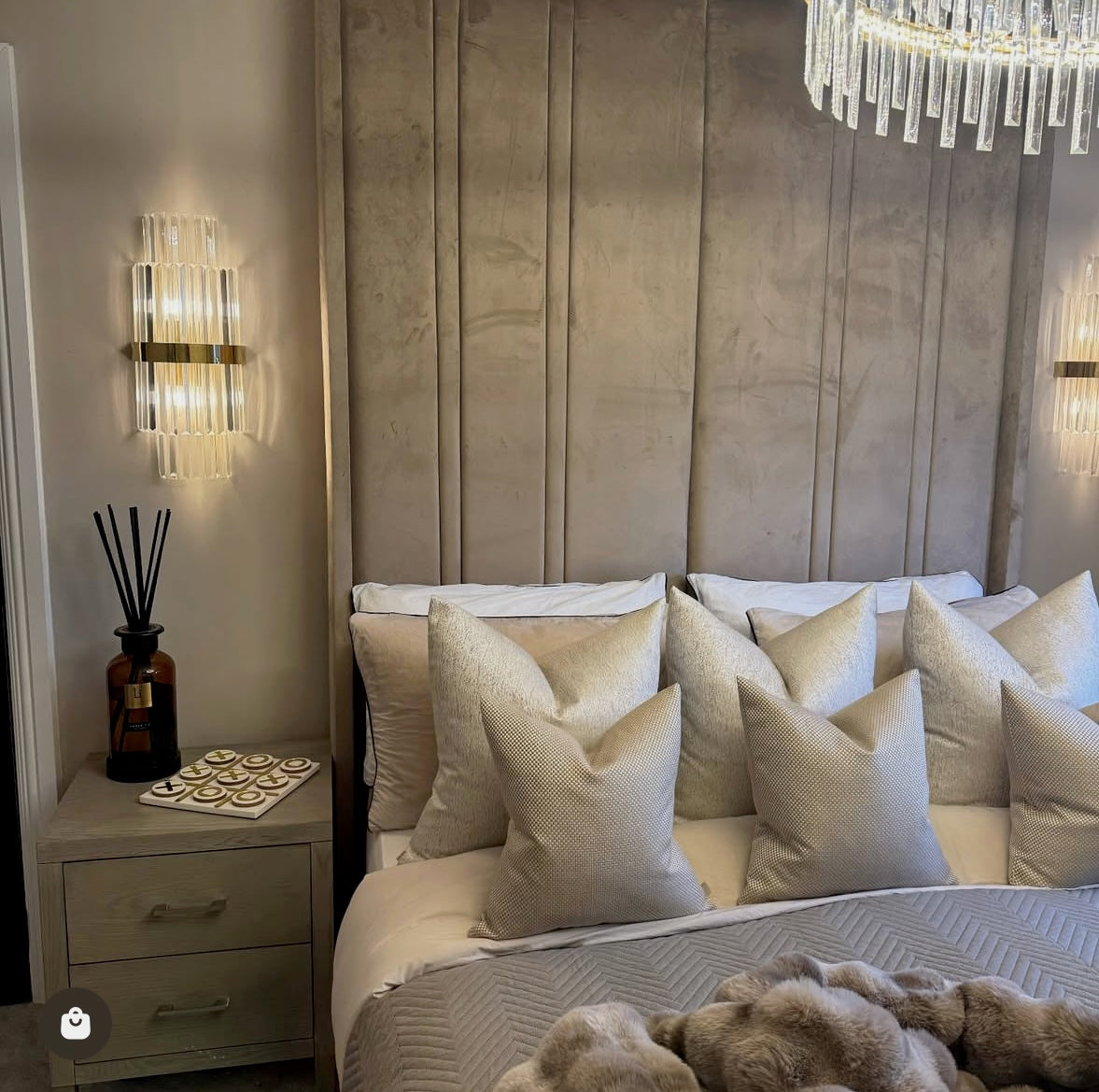 Belair wall light creating warm ambience in bedroom