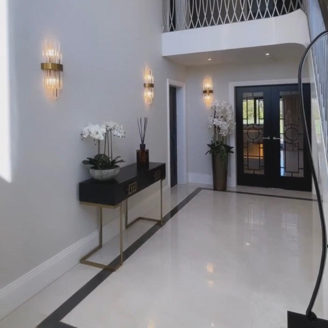 Belair crystal wall lights installed along hallway