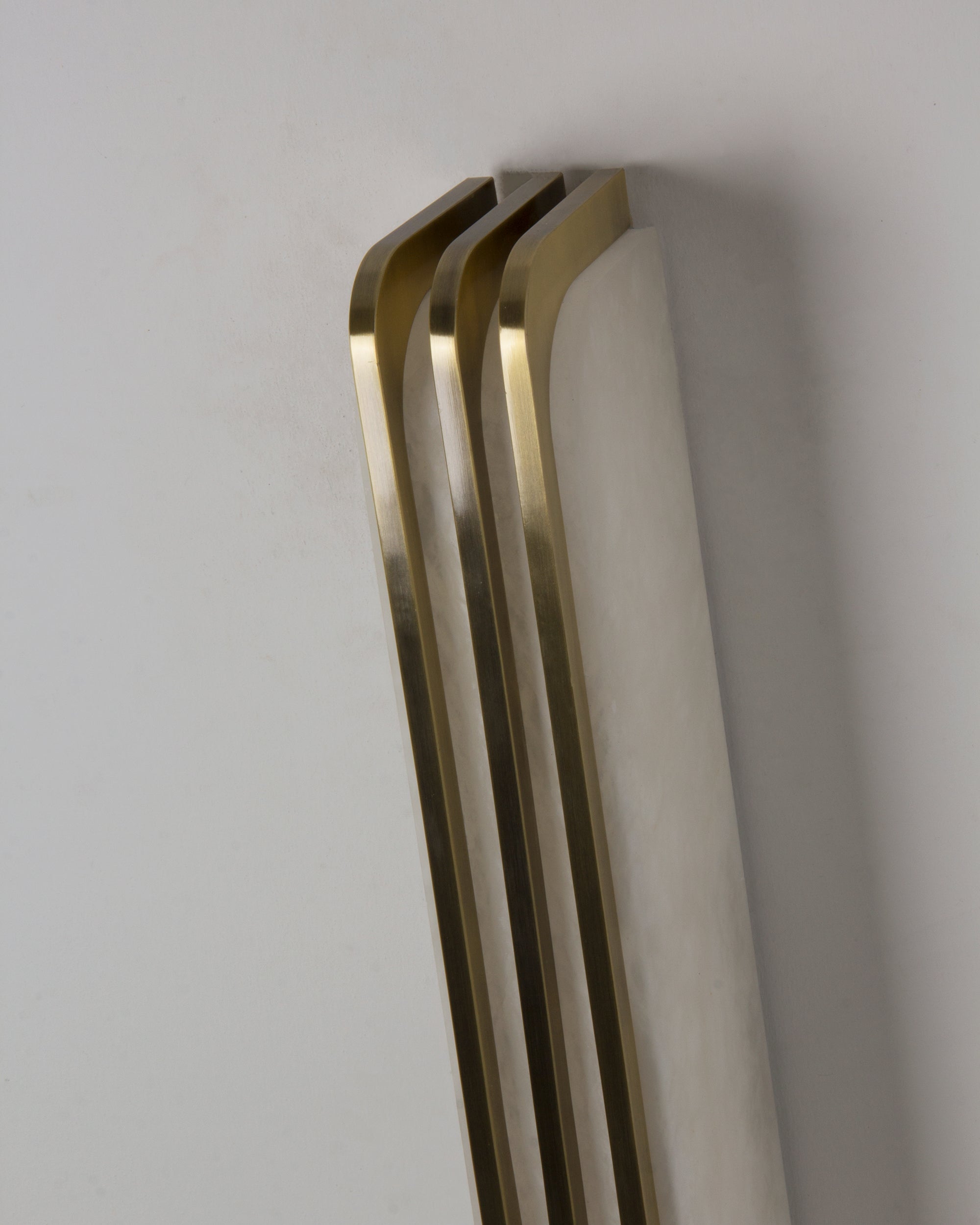 Side profile of Bellagio marble wall light with layered frame
